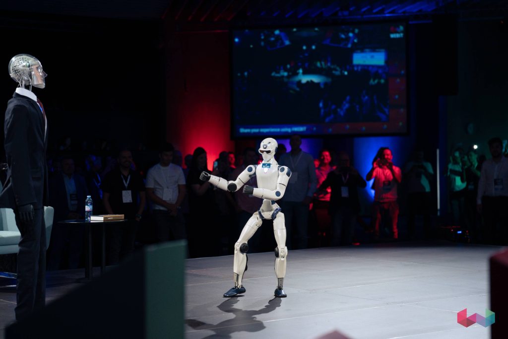 Humanoid robot performing on stage during Webit 2026 in Sofia
